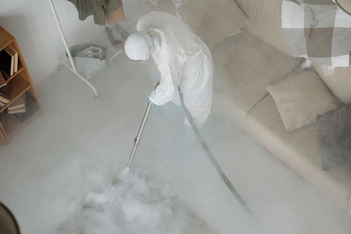 Biohazard cleanup technician in protective equipment, Hayesville, OR